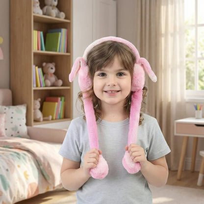 Child wearing pink bunny ear headbands in a room with books and toys.