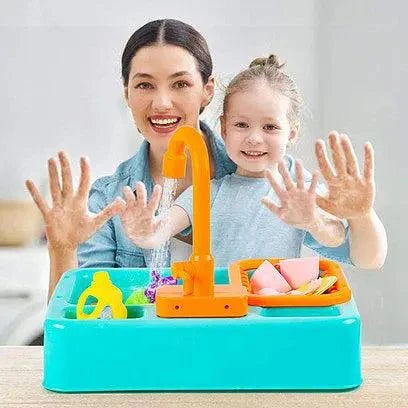 Woman and child playing with a toy kitchen sink set.