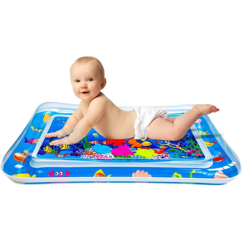 Baby playing on an inflatable water mat with colorful designs on a white background