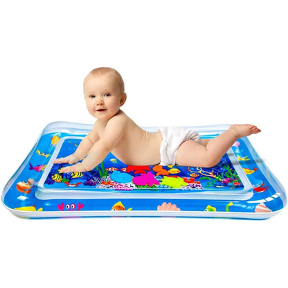 Baby playing on an inflatable water mat with colorful designs on a white background