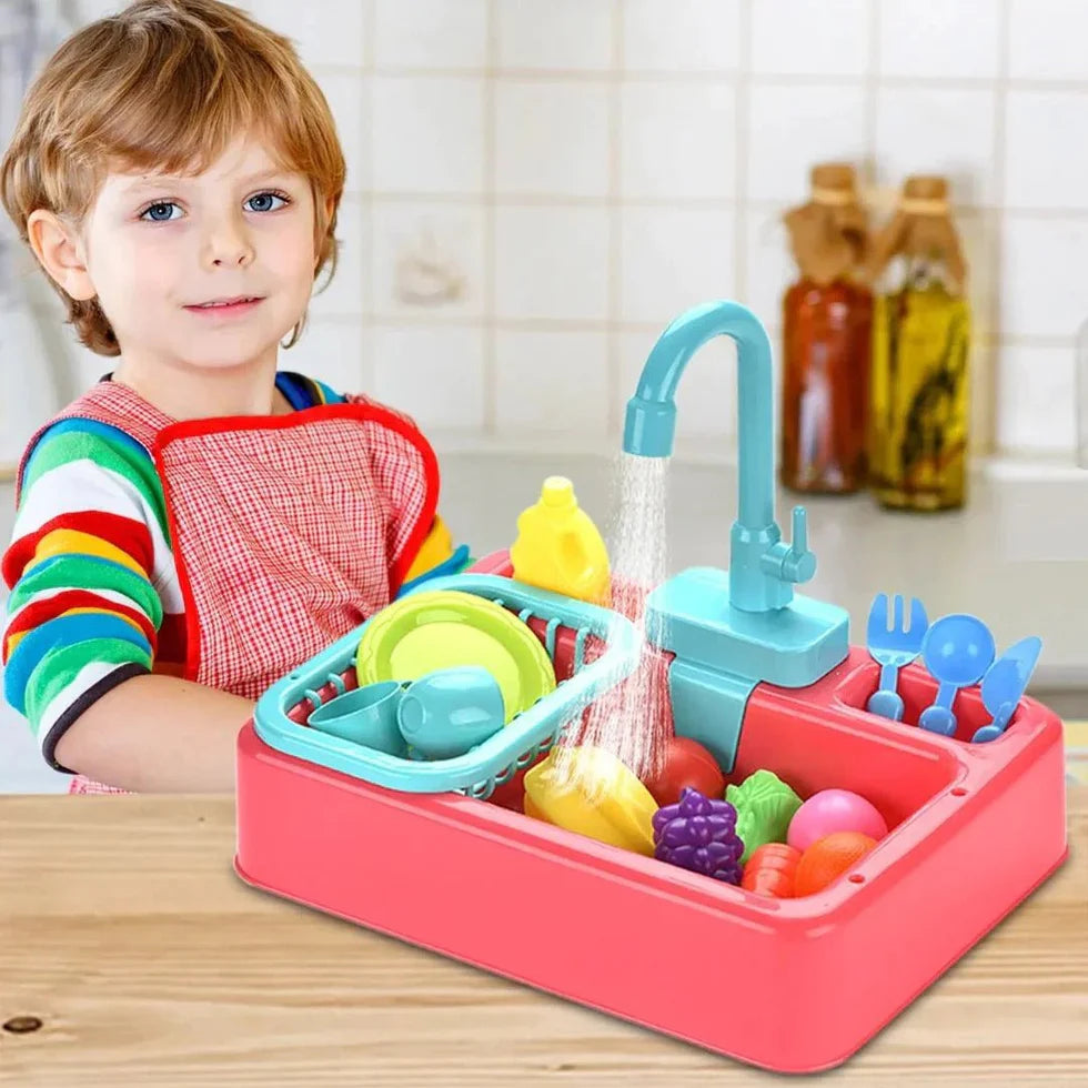 Child playing with a toy kitchen sink set on a wooden table.