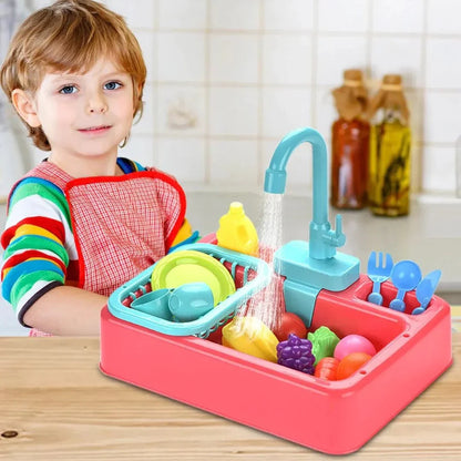 Child playing with a toy kitchen sink set on a wooden table.